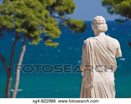 Estatua de Esculapio en el yacimiento arqueol? gico de Empries _ Alt Empord? _ Girona _ Catalunya View Large Photo Image Stock Photo - Estatua de Esculapio en el yacimiento arqueol? gico de Empries _ Alt Empord? _ Girona _ Catalunya. Fotosearch