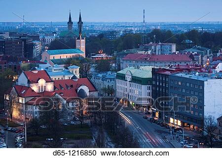 Stock Image - Estonia, Tallinn, Old Town, elevated view over Narva Mantee highway, dusk. Fotosearch