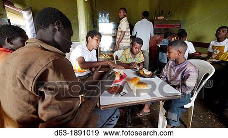 ETHIOPIA The? Salam Cafe? in Chagni, Beni Shangul Gumuz region Boys having breakfast of beans View Large Photo Image Stock Photo - ETHIOPIA The? Salam Cafe? in Chagni, Beni Shangul Gumuz region Boys having breakfast of beans. Fotosearch