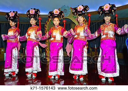 Stock Image - Ethnic Chinese dancers perform a cultural show on the Empress Victoria riverboat on the Yangtze River, China. Fotosearch