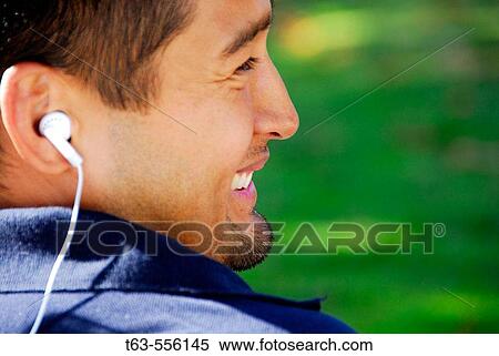 ethnic male listening to music View Large Photo Image Stock Photography - ethnic male listening to music. Fotosearch
