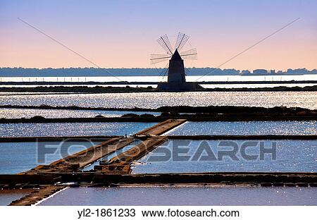 Ettore Infesera windmill on the sea salt making pans, Masala Sicily travel stock photos View Large Photo Image Stock Image - Ettore Infesera windmill on the sea salt making pans, Masala Sicily travel stock photos. Fotosearch