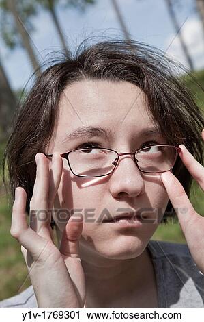 Eurasian teenage girl at a park View Large Photo Image Stock Image - Eurasian teenage girl at a park. Fotosearch