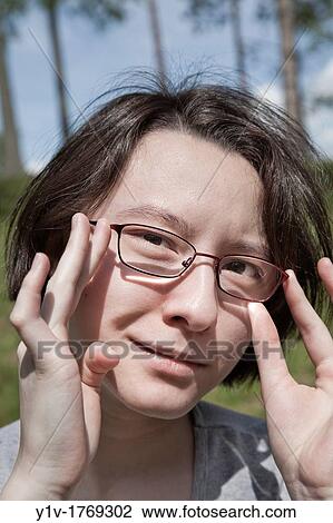 Eurasian teenage girl at a park View Large Photo Image Stock Image - Eurasian teenage girl at a park. Fotosearch