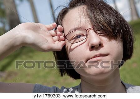 Eurasian teenage girl at a park View Large Photo Image Stock Image - Eurasian teenage girl at a park. Fotosearch