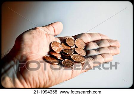 Euro cent coins on palm of a hand isolated on white background. View Large Photo Image Stock Photo - Euro cent coins on palm of a hand isolated on white background.. Fotosearch