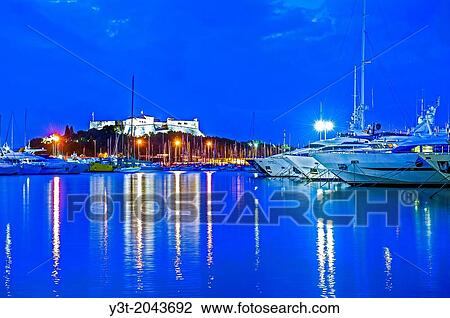 Europe, France, Alpes-Maritimes, Antibes. Marina and Fort Carre at Twilight. View Large Photo Image Stock Image - Europe, France, Alpes-Maritimes, Antibes. Marina and Fort Carre at Twilight.. Fotosearch
