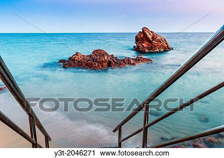 Europe, France, Alpes-Maritimes, Cannes. Red rock at dusk. View Large Photo Image Stock Image - Europe, France, Alpes-Maritimes, Cannes. Red rock at dusk.. Fotosearch