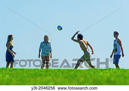 Europe, France, Alpes-Maritimes, Cannes. Young people Playing volley-ball. View Large Photo Image Stock Photograph - Europe, France, Alpes-Maritimes, Cannes. Young people Playing volley-ball.. Fotosearch