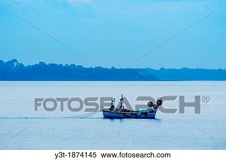 Europe, France, Alpes-Maritimes, Cannes. Fishing boat in the bay of Cannes in the early morning. View Large Photo Image Stock Photography - Europe, France, Alpes-Maritimes, Cannes. Fishing boat in the bay of Cannes in the early morning.. Fotosearch