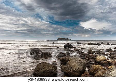 Stock Image - Europe, France, Haute-Corse, Cap Corse, Barcaggio. Giraglia island and its lighthouse.. Fotosearch