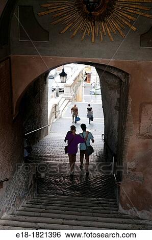 Europe, Italy, Rome Young couple pass under large archway covering outdoor stairway View Large Photo Image Stock Photograph - Europe, Italy, Rome Young couple pass under large archway covering outdoor stairway. Fotosearch