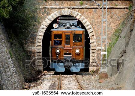 Picture - Europe, Spain, Mediterranean Sea, Balearic Islands, Mallorca, Soller, Soller Railway viewed from the front out of a tunnel on its way. Fotosearch
