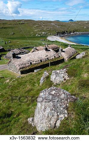 Europe, UK, Scotland, Isle of Lewis, Outer Hebrides - the restored Blackhouse Village of Gearrannan, with some of the restored dwellings now used as self-catering accommodation View Large Photo Image Stock Image - Europe, UK, Scotland, Isle of Lewis, Outer Hebrides - the restored Blackhouse Village of Gearrannan, with some of the restored dwellings now used as self-catering accommodation. Fotosearch