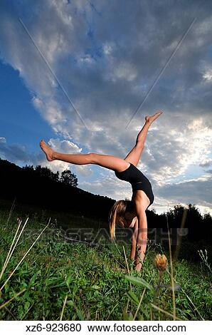 European young doing gymnastics in a meadow in the Pyrenees View Large Photo Image Stock Image - European young doing gymnastics in a meadow in the Pyrenees. Fotosearch