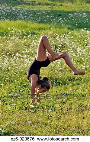 European young doing gymnastics in a meadow in the Pyrenees View Large Photo Image Stock Photograph - European young doing gymnastics in a meadow in the Pyrenees. Fotosearch
