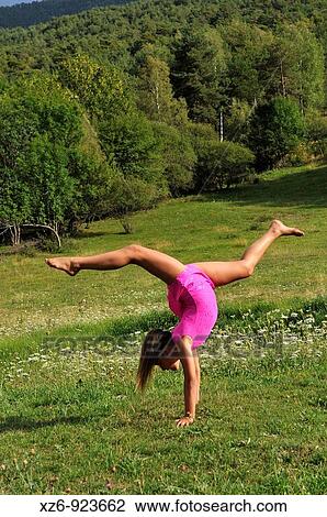 European youth doing gymnastics in a meadow in the Pyrenees View Large Photo Image Stock Image - European youth doing gymnastics in a meadow in the Pyrenees. Fotosearch