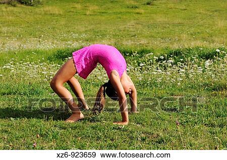 European youth doing gymnastics in a meadow in the Pyrenees View Large Photo Image Stock Photo - European youth doing gymnastics in a meadow in the Pyrenees. Fotosearch