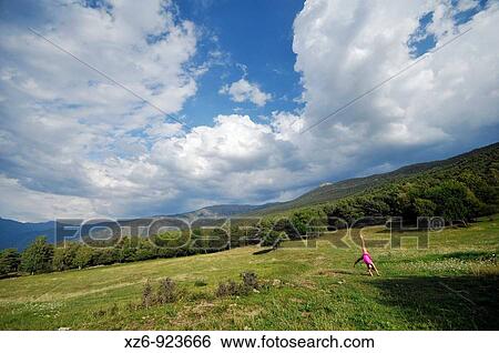 European youth doing gymnastics in a meadow in the Pyrenees View Large Photo Image Stock Photograph - European youth doing gymnastics in a meadow in the Pyrenees. Fotosearch