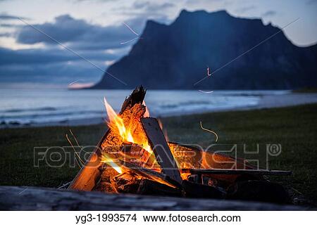 Evening campfire at Utakleiv beach, Lofoten Islands, Norway. View Large Photo Image Picture - Evening campfire at Utakleiv beach, Lofoten Islands, Norway.. Fotosearch
