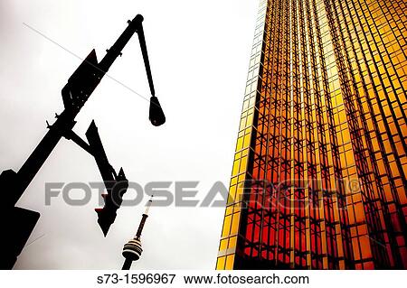 Stock Photo - Evening in the financial district with CN Tower in the background, Toronto, Ontario. Fotosearch