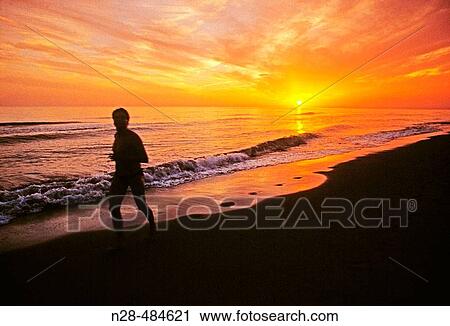 Evening jogging in Playa de las Dunas. Marbella. Malaga-province. Costa del Sol. Andalucia. Spain. View Large Photo Image Stock Image - Evening jogging in Playa de las Dunas. Marbella. Malaga-province. Costa del Sol. Andalucia. Spain.. Fotosearch