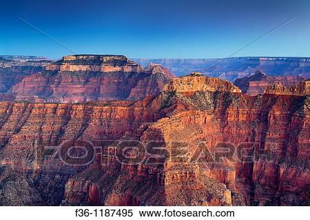 Evening light over red rock cliffs along the North Rim at Point Sublime, Grand Canyon National Park, Arizona View Large Photo Image Stock Photography - Evening light over red rock cliffs along the North Rim at Point Sublime, Grand Canyon National Park, Arizona. Fotosearch