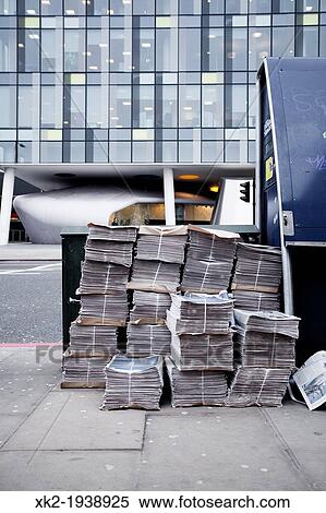 Evening Newspapers ready to be delivered, near Southwark tube station, London, UK View Large Photo Image Stock Photography - Evening Newspapers ready to be delivered, near Southwark tube station, London, UK. Fotosearch