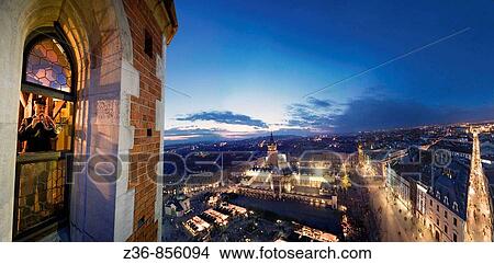 Every hour trumpeter plays anthem from St Mary's Church Tower, Krakow Poland View Large Photo Image Picture - Every hour trumpeter plays anthem from St Mary's Church Tower, Krakow Poland. Fotosearch