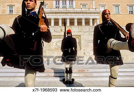 Stock Image - Evzones (soldiers). Changing of guard in front of the parliament house, at the tomb of the unknown soldier. Syntagma square, Athens, Greece, Europe.. Fotosearch