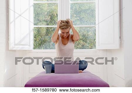 Exasperated young woman online View Large Photo Image Stock Image - Exasperated young woman online. Fotosearch