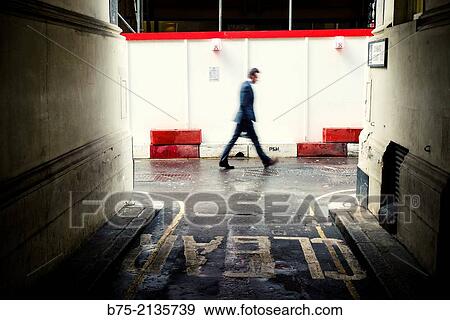 Executive blur, walking seen through an alley in The City, London, England, UK, Europe View Large Photo Image Stock Photo - Executive blur, walking seen through an alley in The City, London, England, UK, Europe. Fotosearch