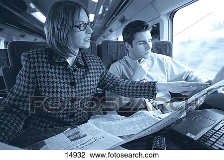 Executive couple in train View Large Photo Image Stock Image - Executive couple in train. Fotosearch