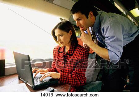 Executive couple in train View Large Photo Image Stock Photo - Executive couple in train. Fotosearch