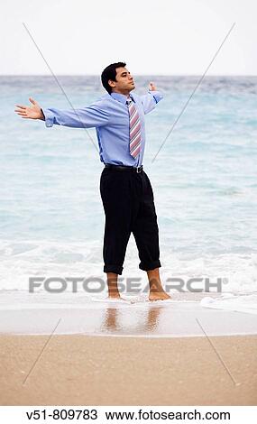 Executive feeling free by the sea View Large Photo Image Stock Image - Executive feeling free by the sea. Fotosearch