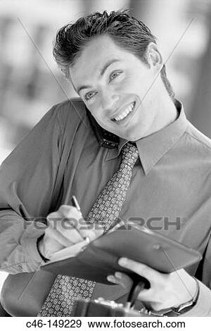 Executive on cell phone View Large Photo Image Stock Photo - Executive on cell phone. Fotosearch