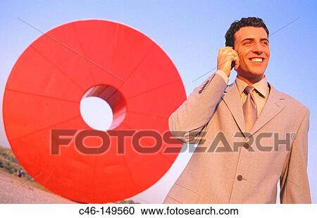 Executive talking on cellular phone View Large Photo Image Stock Image - Executive talking on cellular phone. Fotosearch