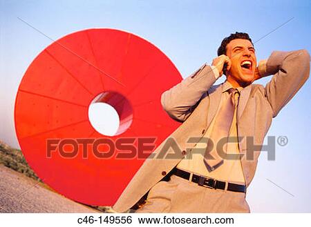 Executive talking on cellular phone View Large Photo Image Stock Photograph - Executive talking on cellular phone. Fotosearch