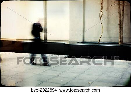 Executive unrecognizable walking on a street in the City of London, England, UK View Large Photo Image Picture - Executive unrecognizable walking on a street in the City of London, England, UK. Fotosearch