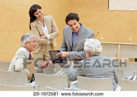 Stock Image - Executives at Convention Centre, Coaching, Business, Donostia, San Sebastian, Basque Country, Spain.. Fotosearch