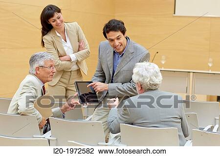 Stock Image - Executives at Convention Centre, Coaching, Business, Donostia, San Sebastian, Basque Country, Spain.. Fotosearch