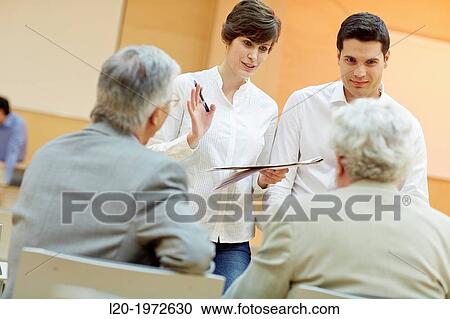 Stock Image - Executives at Convention Centre, Coaching, Business, Donostia, San Sebastian, Basque Country, Spain.. Fotosearch