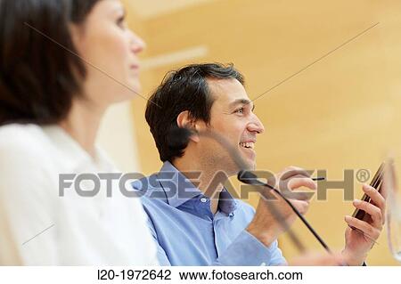 Stock Image - Executives at Convention Centre, Business, Donostia, San Sebastian, Basque Country, Spain.. Fotosearch