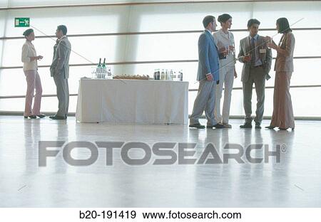 Executives at trade show, break time View Large Photo Image Stock Photo - Executives at trade show, break time. Fotosearch