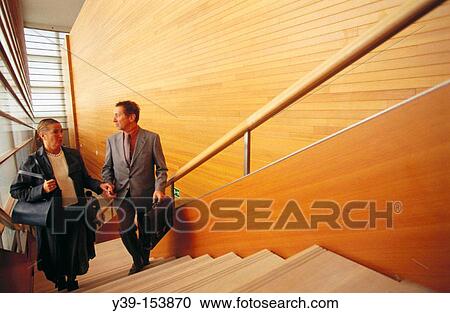 Executives climbing stairs View Large Photo Image Stock Image - Executives climbing stairs. Fotosearch