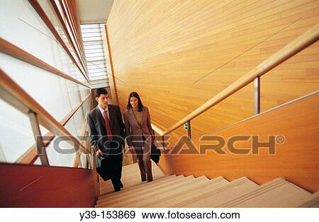 Executives climbing stairs View Large Photo Image Stock Photo - Executives climbing stairs. Fotosearch