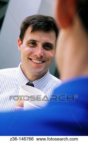 Executives having coffee View Large Photo Image Stock Photograph - Executives having coffee. Fotosearch