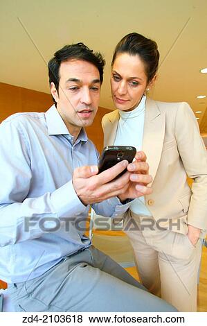 Executives using smartphone View Large Photo Image Stock Photo - Executives using smartphone. Fotosearch