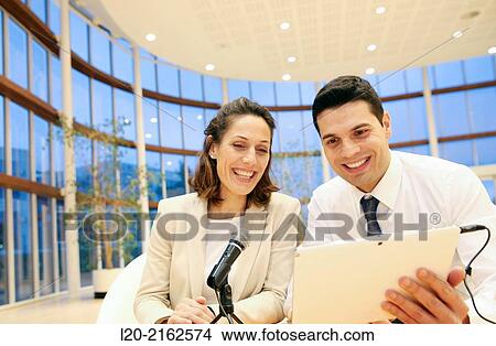 Executives with digital tablet, video conference View Large Photo Image Picture - Executives with digital tablet, video conference. Fotosearch