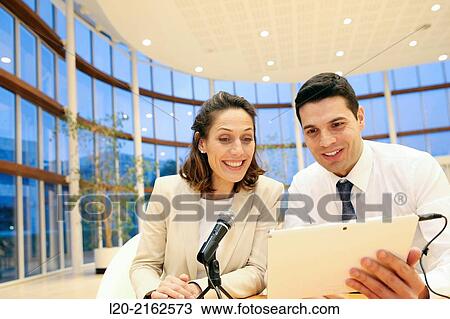 Executives with digital tablet, video conference View Large Photo Image Stock Image - Executives with digital tablet, video conference. Fotosearch
